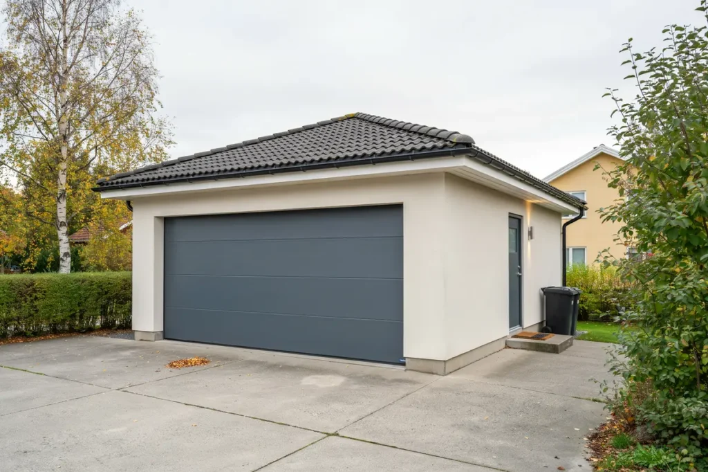 byte till isolerad garageport med sidod rr i k llered m lndal
